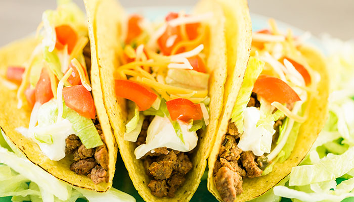 Three crunchy tacos from The Lodge of Spring Grove Restaurant in Spring Grove, Illinois.